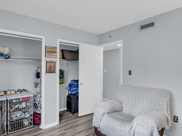 sitting room with hardwood / wood-style floors