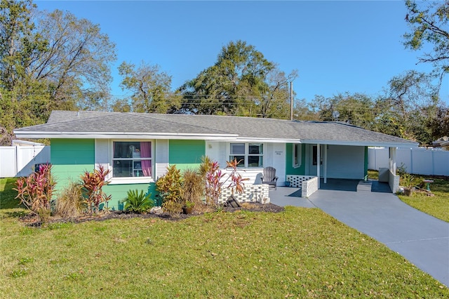 ranch-style house with a carport and a front yard