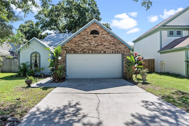 front of property with a garage and a front yard