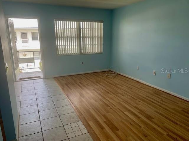 spare room with light tile patterned floors