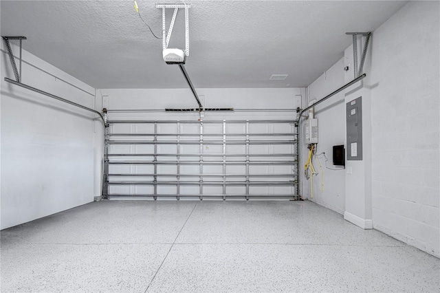 garage featuring a garage door opener and electric panel