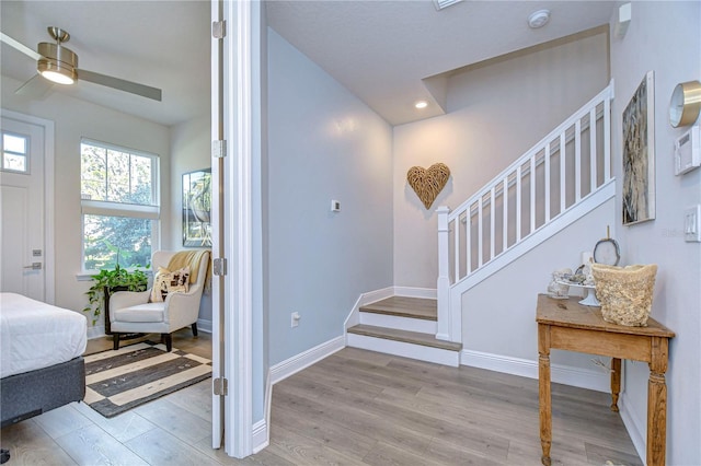 interior space with ceiling fan and light wood-type flooring