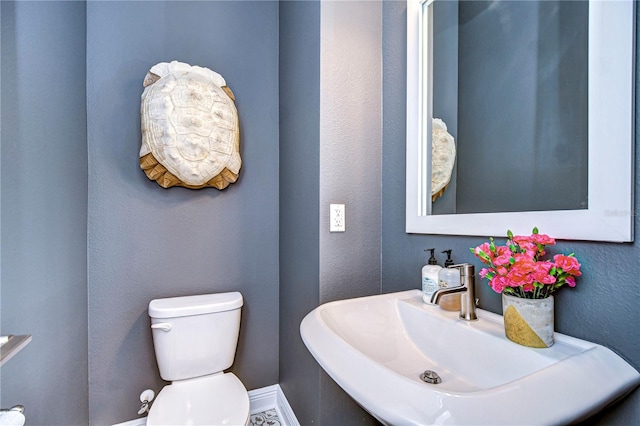 bathroom with sink and toilet