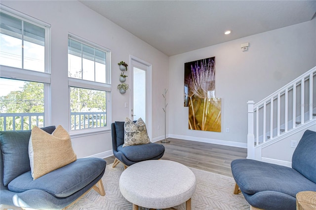 living area with hardwood / wood-style floors