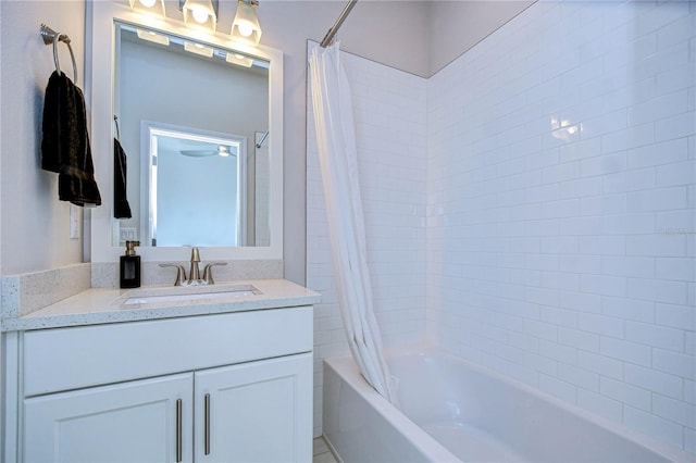 bathroom with shower / tub combo and vanity