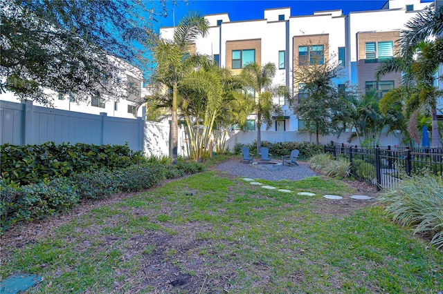 view of yard with a fire pit