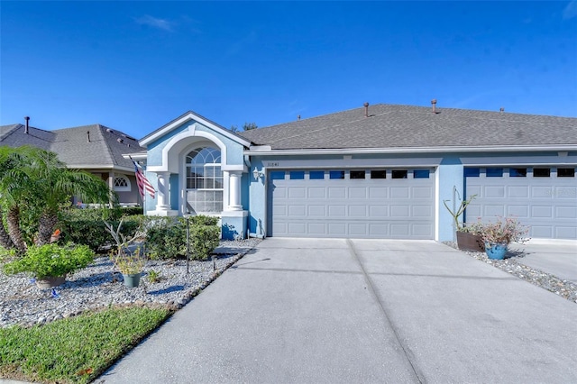 ranch-style house featuring a garage