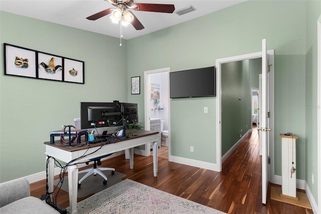 office with dark wood-type flooring and ceiling fan