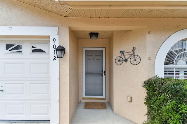 doorway to property featuring a garage