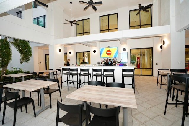 15695 Grove Resort Ave Unit 4303, Winter Garden, FL 34787 - dining room with ceiling fan, a high ceiling, and light floors