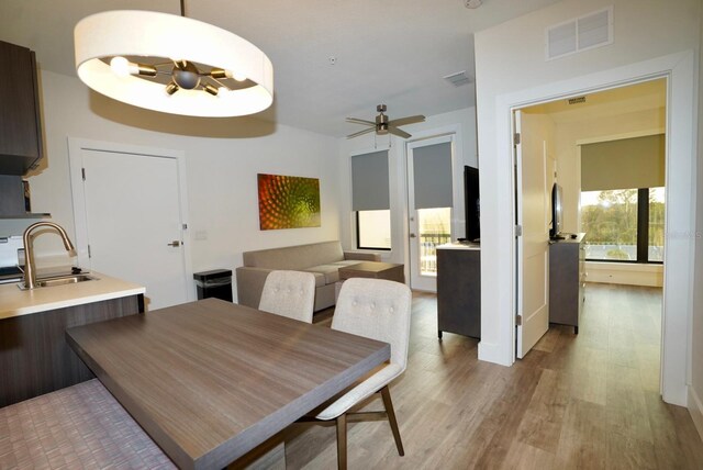 15695 Grove Resort Ave Unit 4303, Winter Garden, FL 34787 - dining room with light wood-style flooring and a ceiling fan