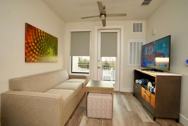 15695 Grove Resort Ave Unit 4303, Winter Garden, FL 34787 - living room featuring light wood-style floors, ceiling fan, and baseboards