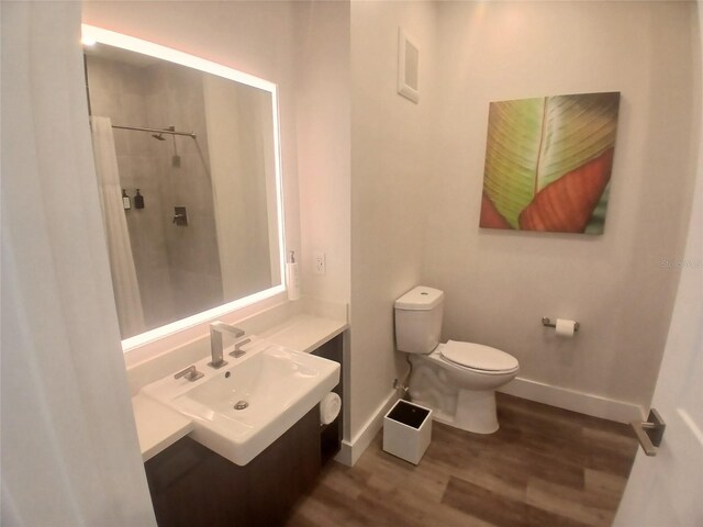 15695 Grove Resort Ave Unit 4303, Winter Garden, FL 34787 - full bath featuring wood finished floors, toilet, vanity, and baseboards