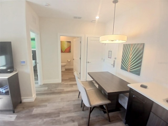 15695 Grove Resort Ave Unit 4303, Winter Garden, FL 34787 - dining space featuring light wood-style flooring and baseboards