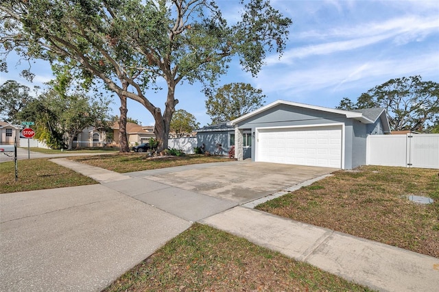 view of front facade featuring a garage and a front lawn