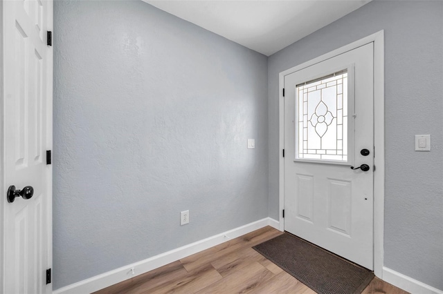 foyer with light wood-type flooring