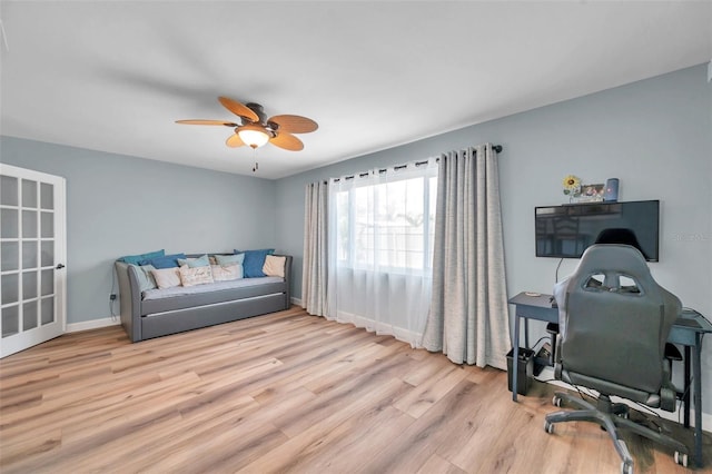 office space with ceiling fan and light wood-type flooring