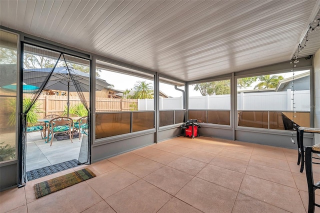 unfurnished sunroom with a healthy amount of sunlight