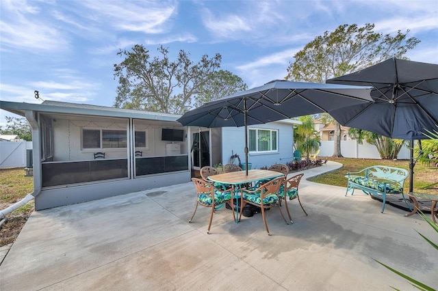 view of patio / terrace featuring a sunroom