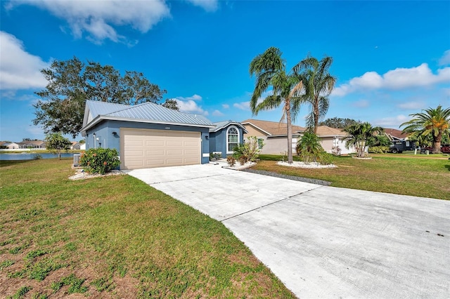 ranch-style home with a garage and a front lawn