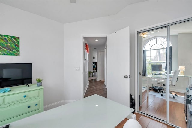 home office featuring hardwood / wood-style flooring and lofted ceiling