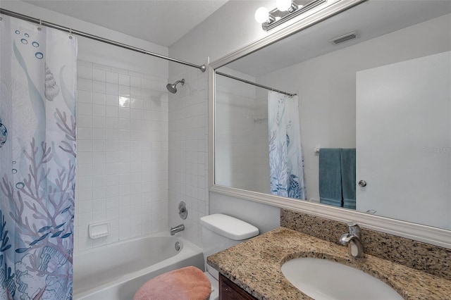 full bathroom with vanity, shower / bath combination with curtain, and toilet