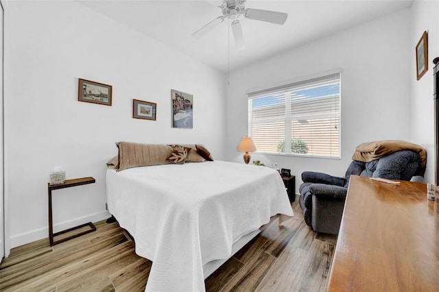 bedroom featuring hardwood / wood-style flooring and ceiling fan