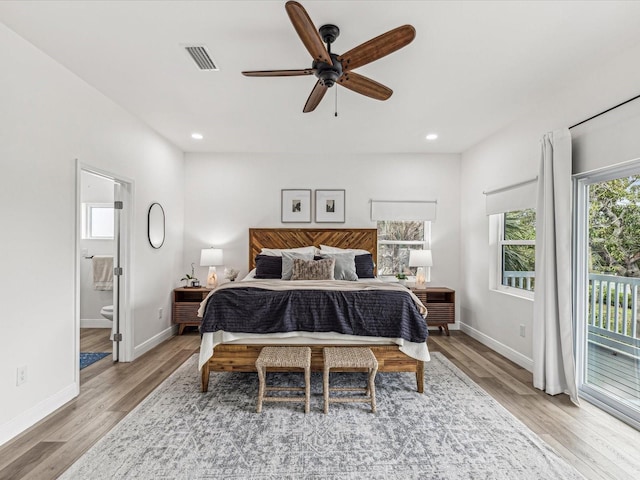 bedroom with ceiling fan, connected bathroom, light wood-type flooring, and access to outside