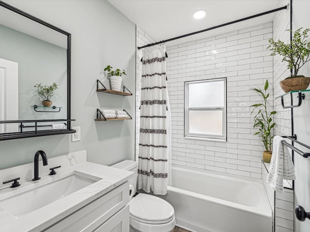 full bathroom with vanity, toilet, and shower / bath combo with shower curtain