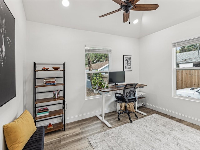 home office with wood-type flooring, lofted ceiling, and ceiling fan