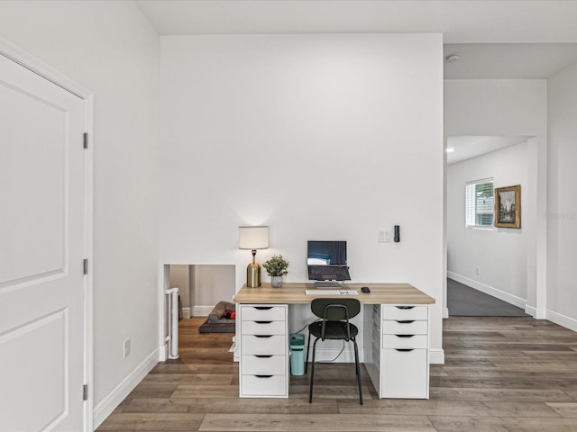 home office featuring dark hardwood / wood-style flooring