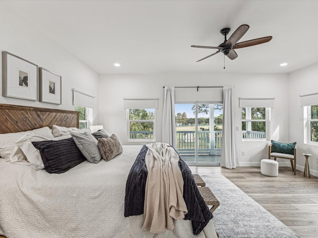 bedroom with ceiling fan, light wood-type flooring, and access to outside