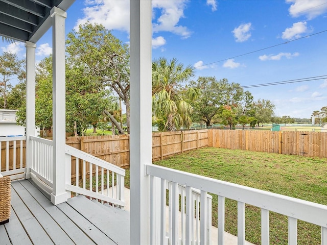 wooden terrace with a yard