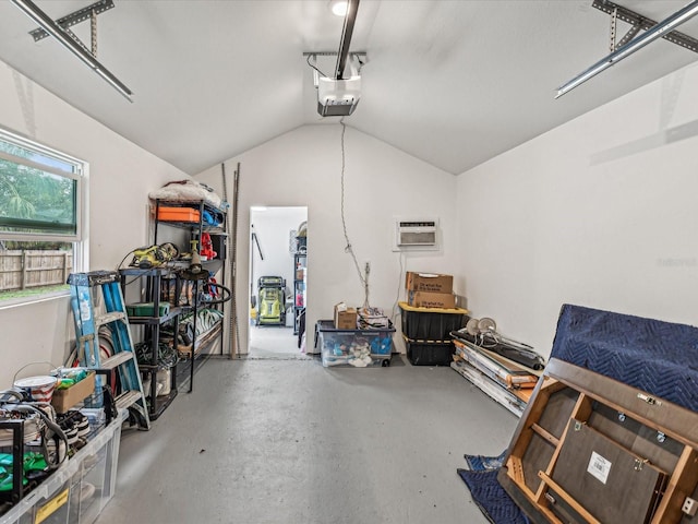 garage featuring a garage door opener and a wall mounted AC