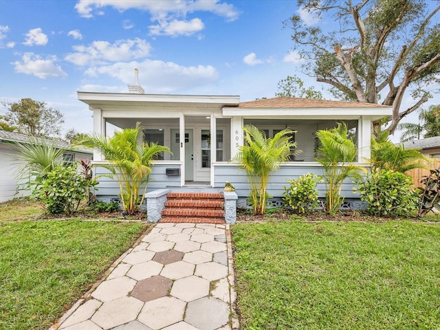 bungalow-style home featuring a front lawn