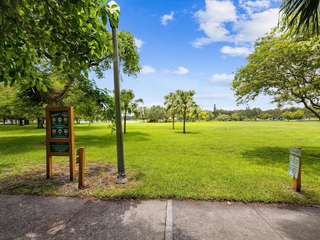 surrounding community featuring a yard