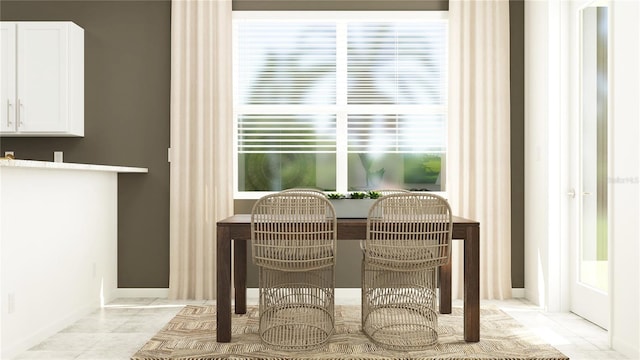 dining space with light tile patterned floors