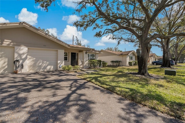 single story home with a front lawn and a garage