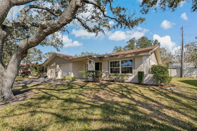 ranch-style house with a front yard and a garage