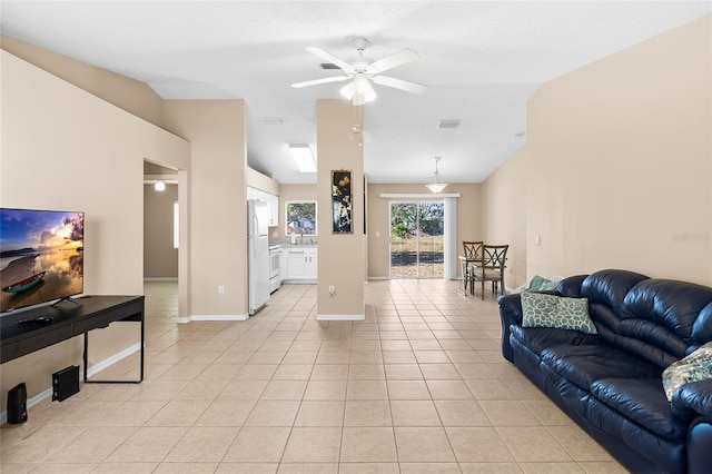 tiled living room with lofted ceiling and ceiling fan