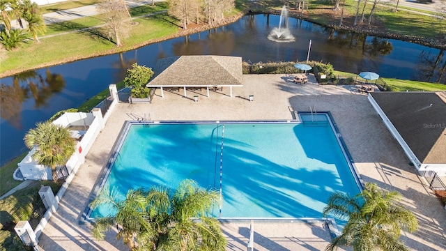 view of swimming pool featuring a water view