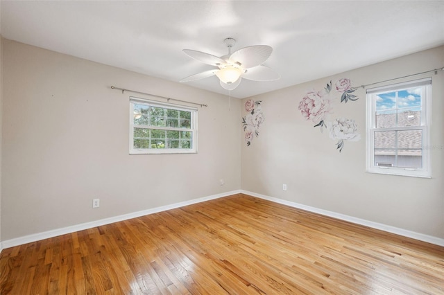 spare room featuring ceiling fan and light hardwood / wood-style flooring