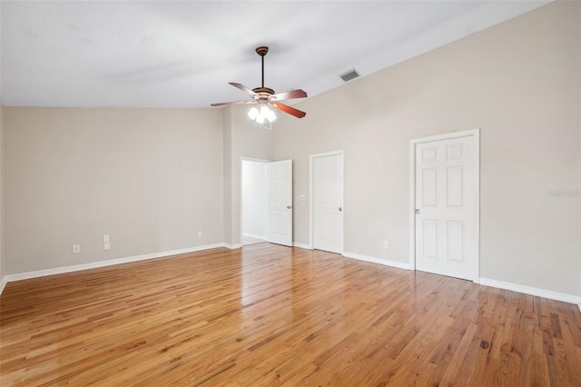 unfurnished bedroom with high vaulted ceiling, light hardwood / wood-style floors, and ceiling fan