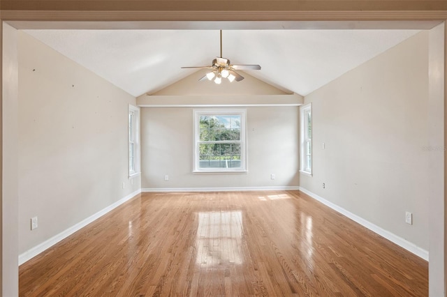 unfurnished room featuring ceiling fan, lofted ceiling, and light wood-type flooring