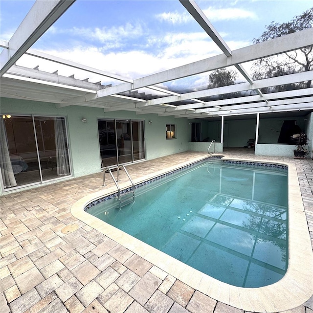 view of swimming pool featuring a lanai and a patio