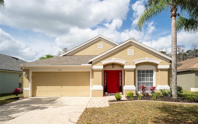 ranch-style home featuring a garage, concrete driveway, a shingled roof, and stucco siding