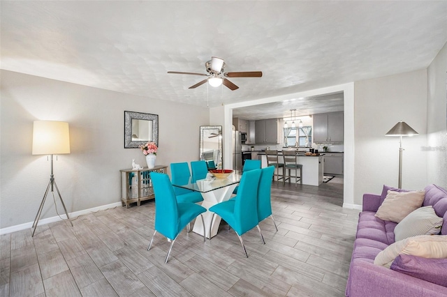 dining space featuring ceiling fan