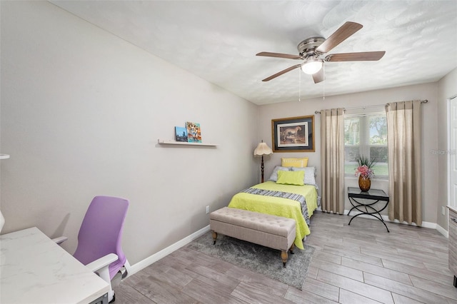 bedroom with ceiling fan and light hardwood / wood-style flooring