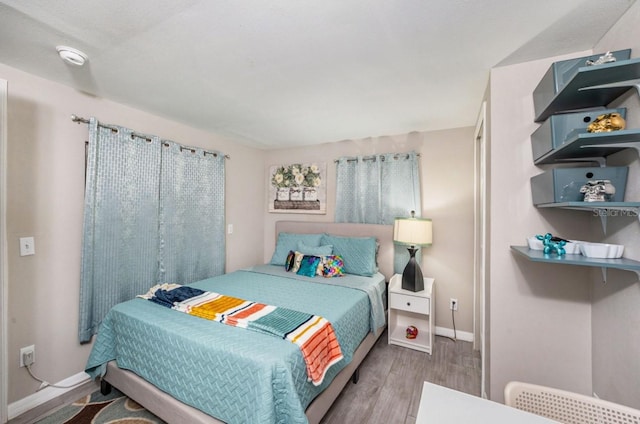 bedroom with light wood-type flooring