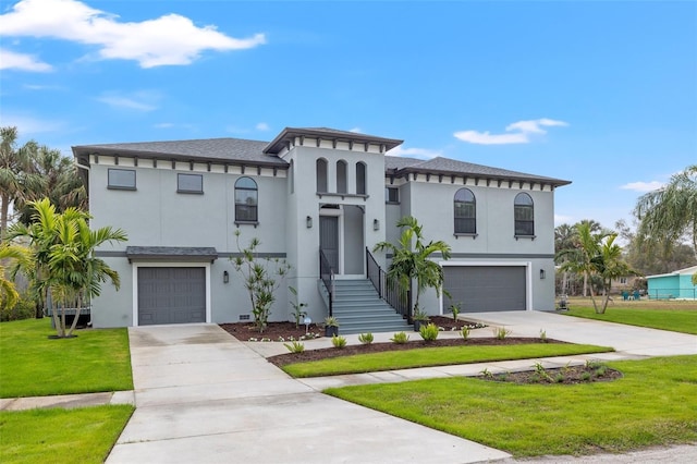 view of front facade featuring a garage and a front lawn